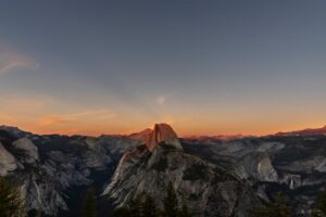 Half dome mountain illuminated by sunset light